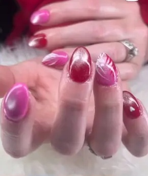 Showanda's recent work: pink chrome nails with swirling accents